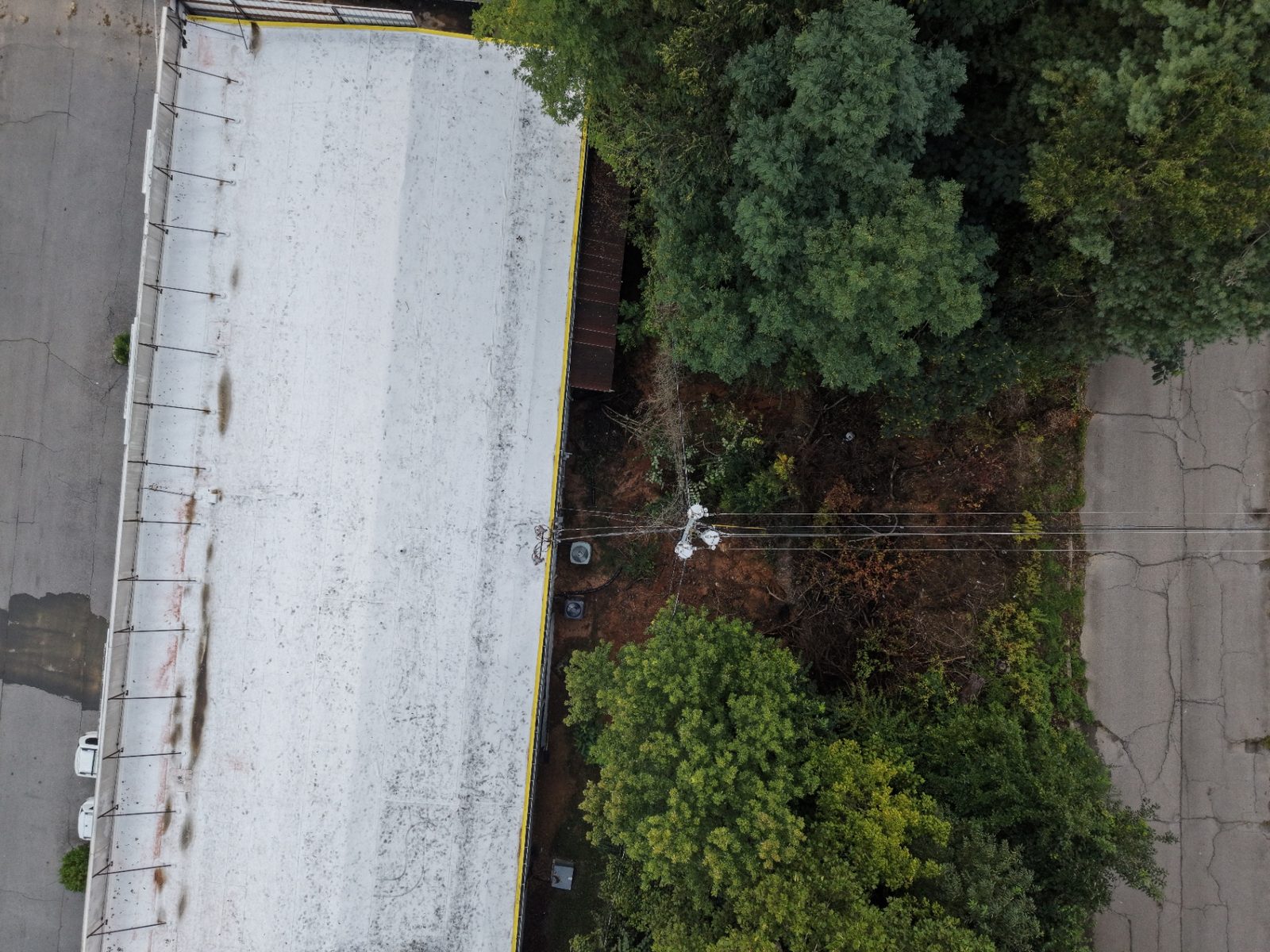 Actual T-CAS commercial roof and adjoining property aerial documentation